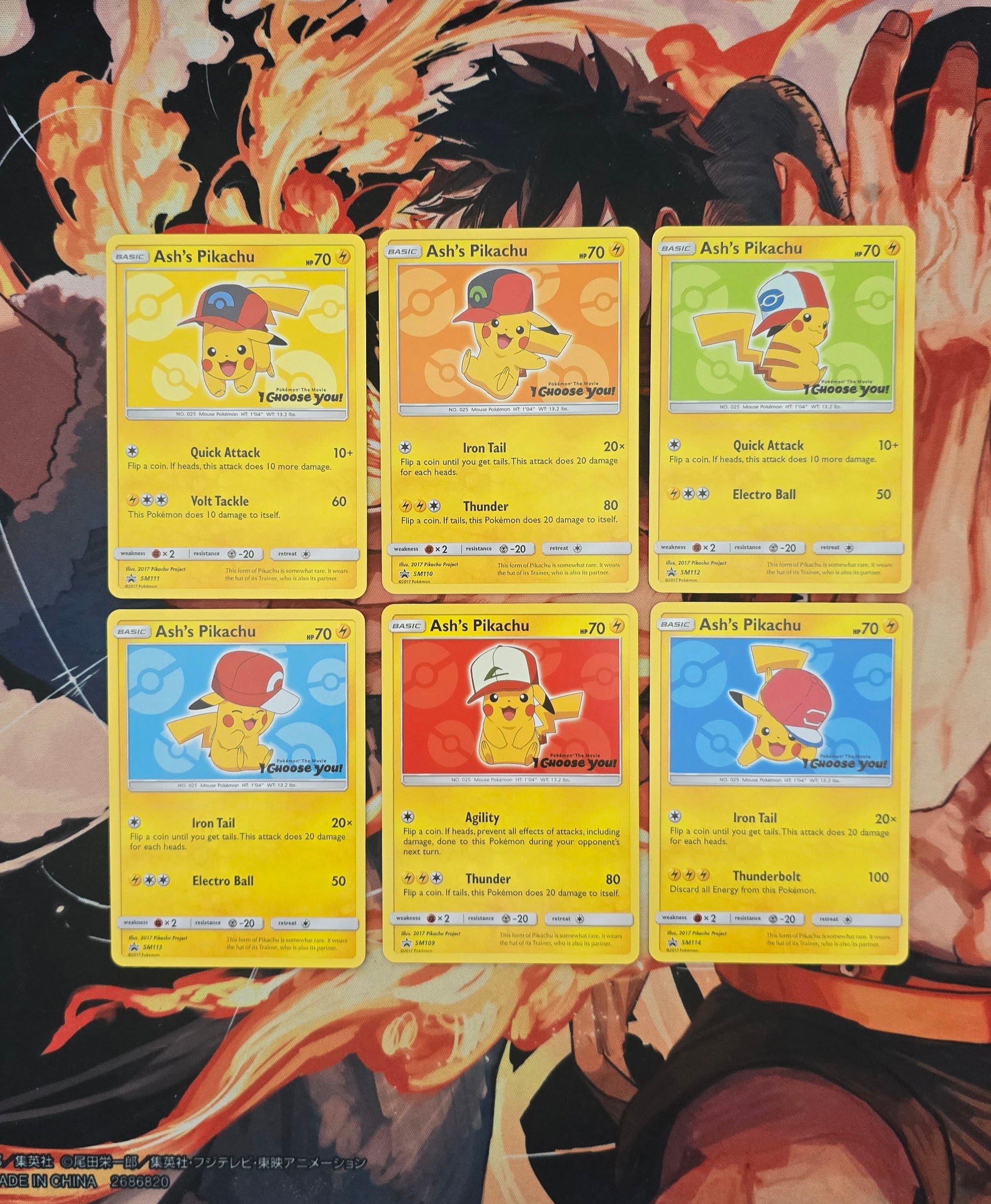 Set of six Pikachu trading cards in front of a colorful background